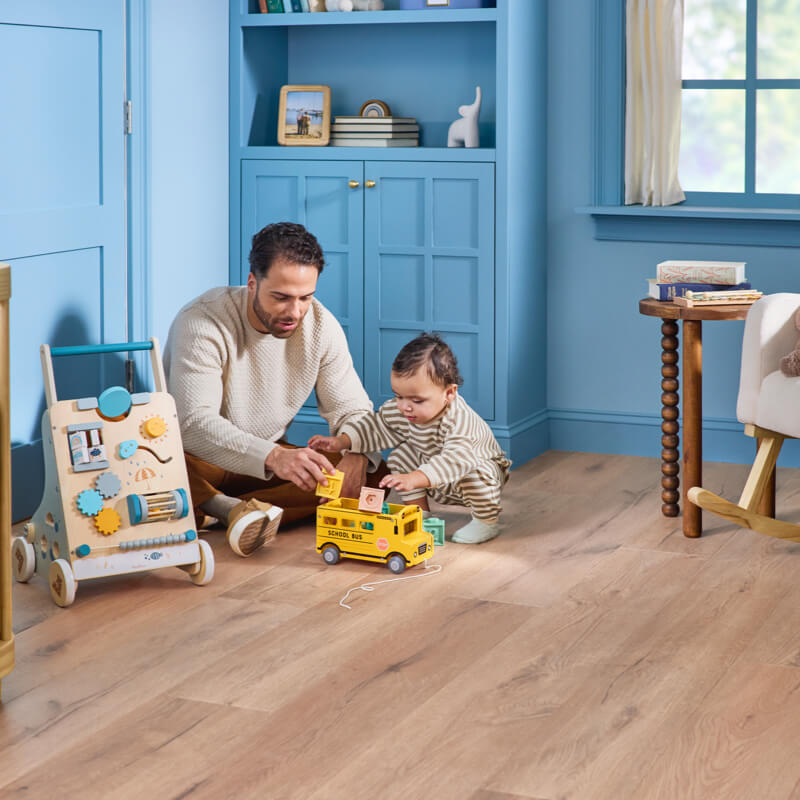 Dad child playing with toys | Chacon Flooring